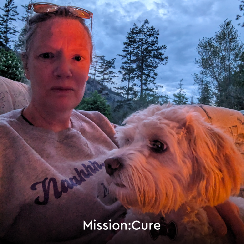 Image of pancreatitis patient Megan holding her dog in her lap.