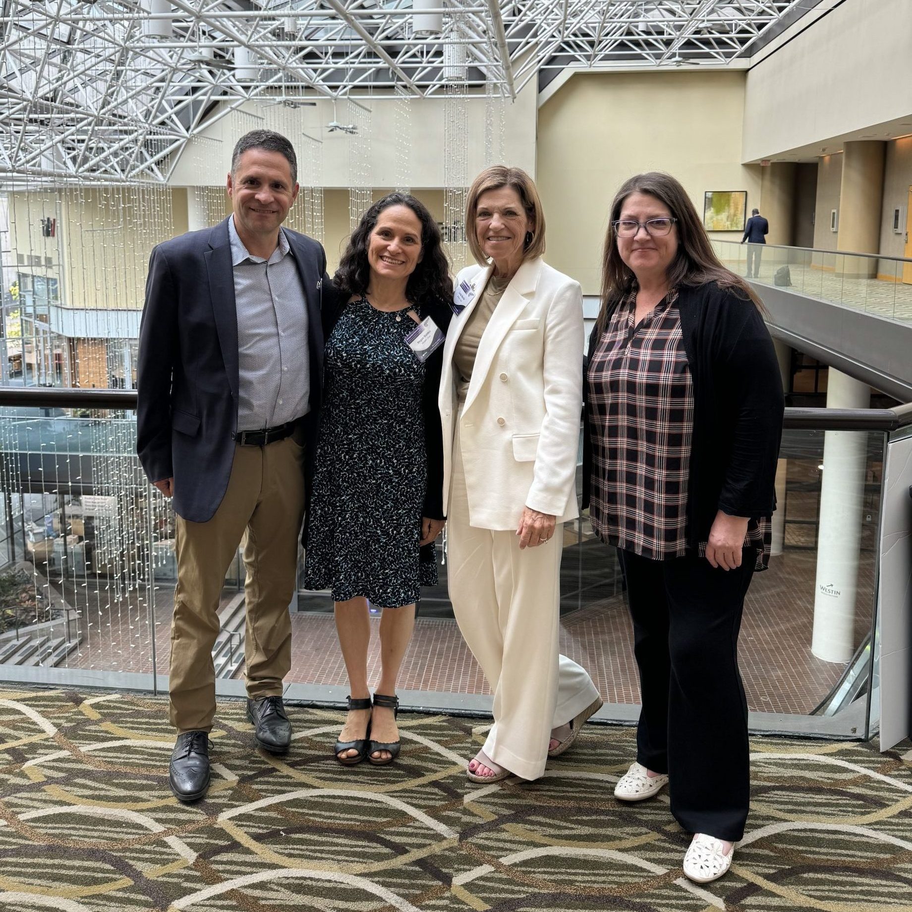 Co-founders Eric and Megan golden with Linda and Amy at Pancreasfest 2024